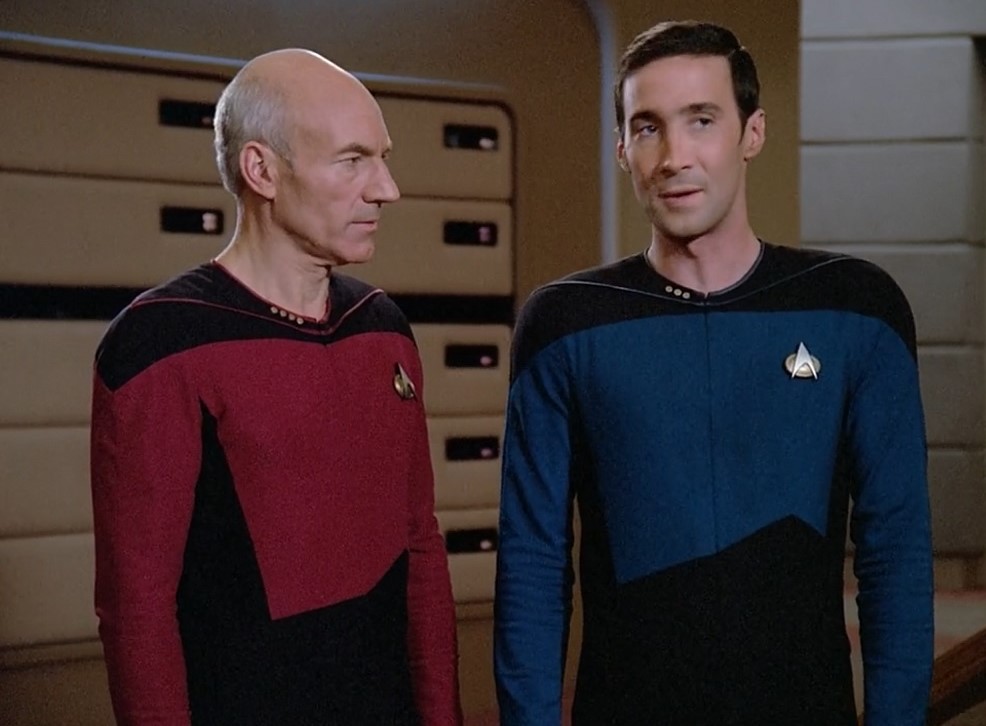 Still frame from Star Trek: The Next Generation showing Picard and Dr Maddox.