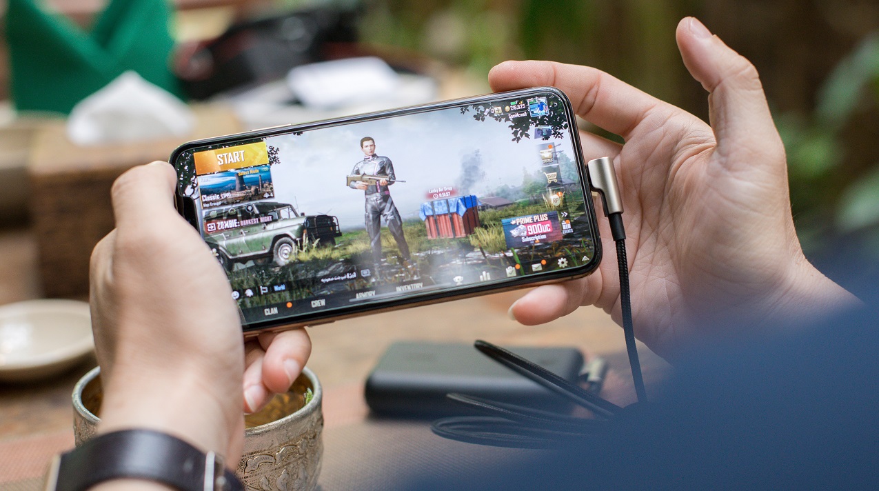 Stock photo of a person playing a mobile game