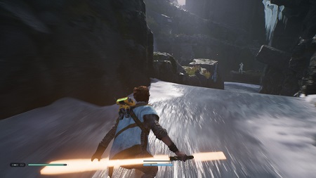 Screenshot of Jedi: Fallen Order showing the player character sliding down an icy canyon.