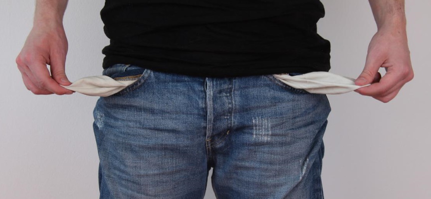 A stock photo of a person with empty pockets