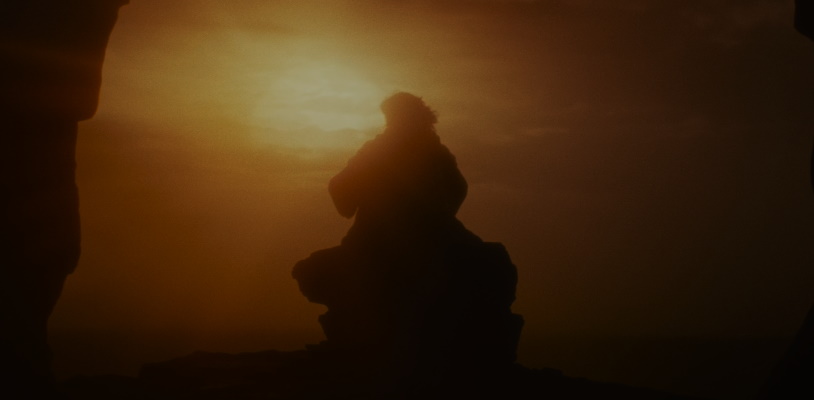 Still frame from Star Wars: The Last Jedi (2017) showing Luke's final moments.