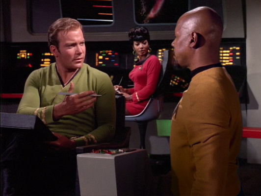 Still frame from Star Trek: Deep Space Nine showing Kirk and Sisko meeting.