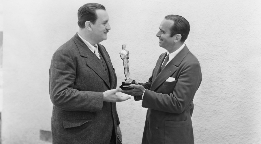 Photo from the first Oscars ceremony showing an award being presented.