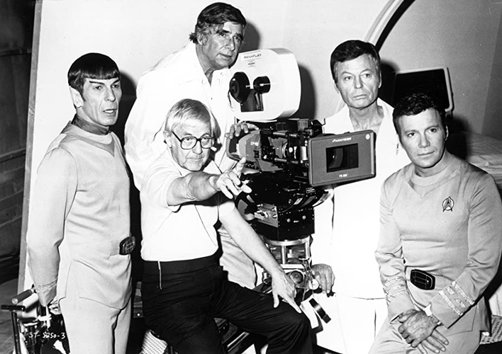 Behind-the-scenes photo from Star Trek: The Motion Picture showing director Robert Wise, creator Gene Roddenberry, William Shatner, DeForest Kelley, and Leonard Nimoy.