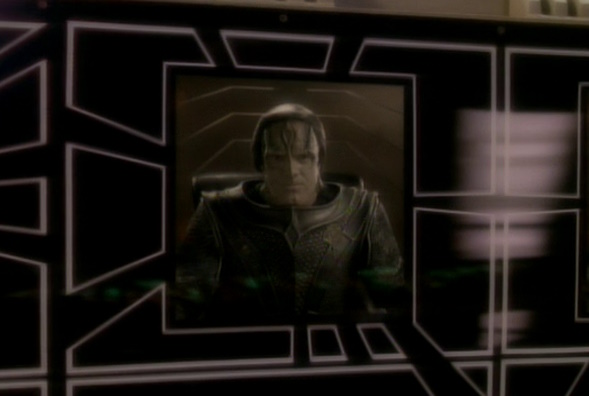 Still frame from Star Trek: Deep Space Nine showing a former commander of Terok Nor on a viewscreen.