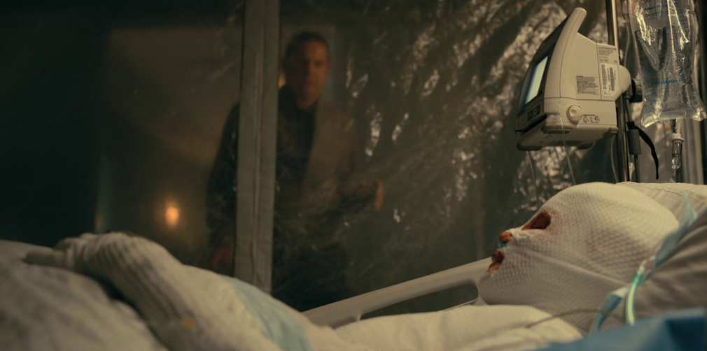 Still frame from The Fall of the House of Usher (2023) showing a woman in a hospital bed, covered in bandages.