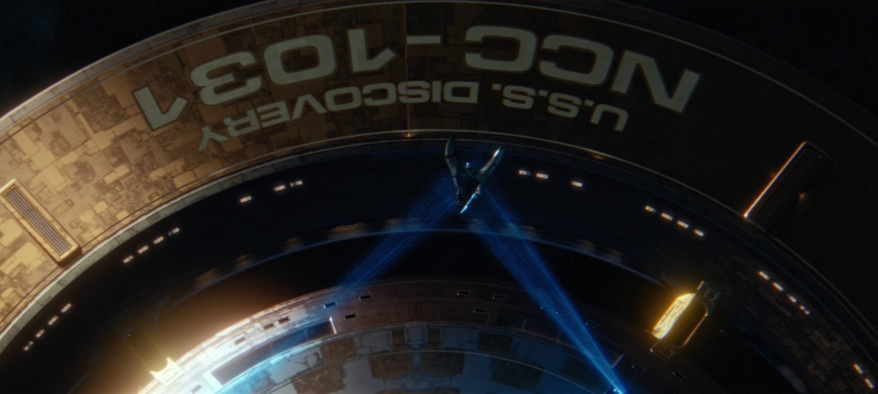 Still frame from the Short Treks episode Calypso showing the USS Discovery engaging its tractor beam.