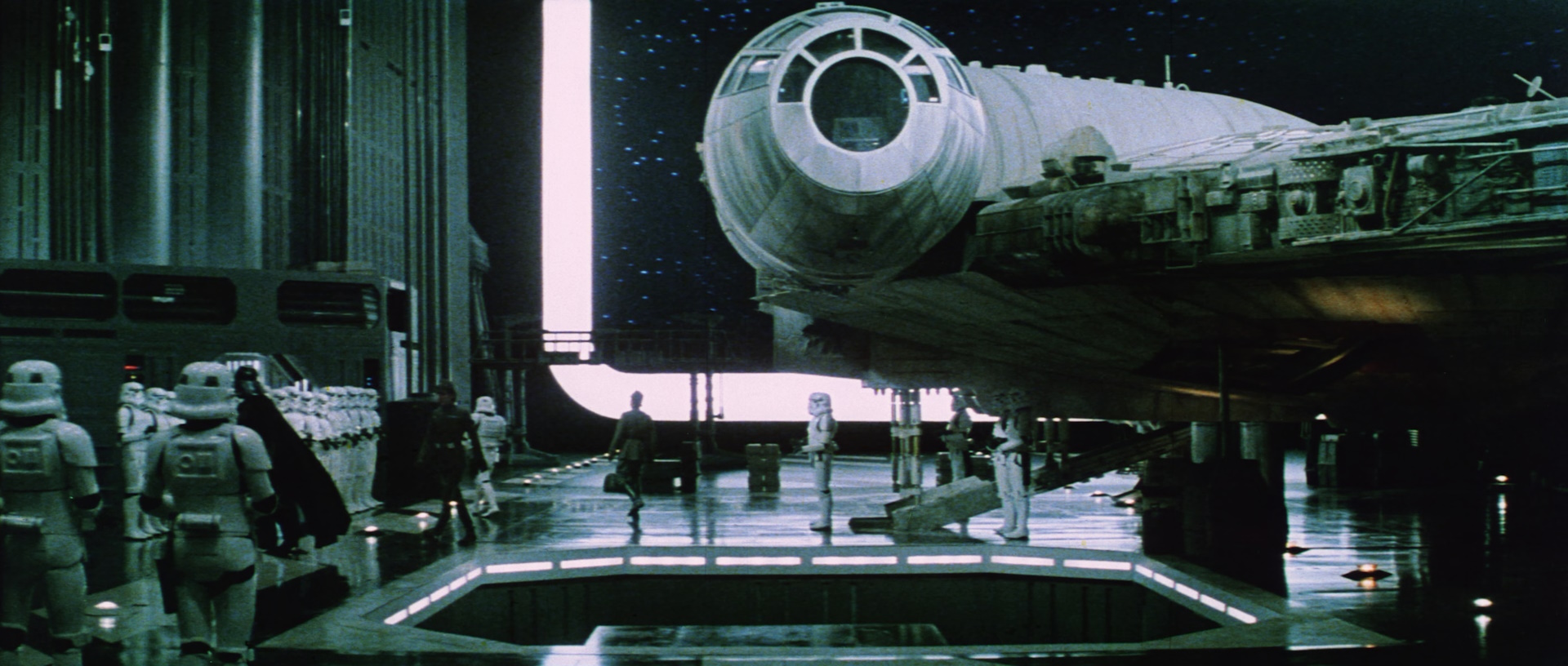 Still frame from Star Wars (1977) showing the Millennium Falcon in the Death Star's hangar bay.