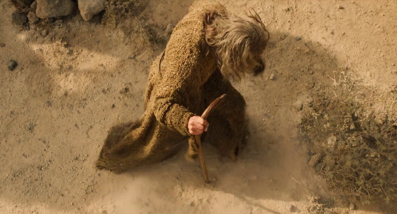 Still frame from The Rings of Power Season 2 trailer showing the Stranger.