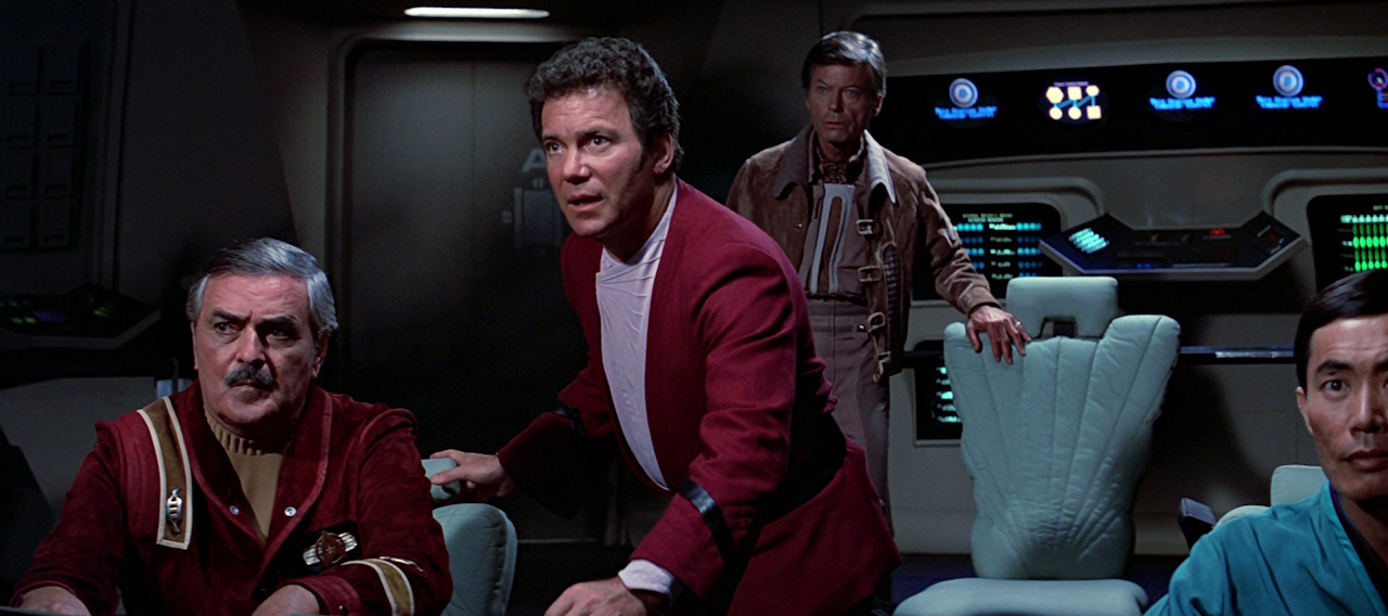 Still frame from Star Trek III: The Search for Spock (1984) showing Scotty, Kirk, Dr McCoy, and Sulu.