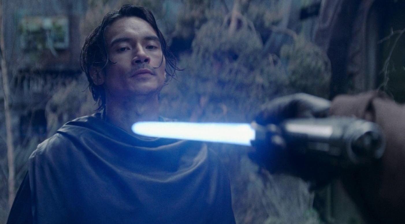 Still frame from Star Wars: The Acolyte showing a character wielding a lightsaber.