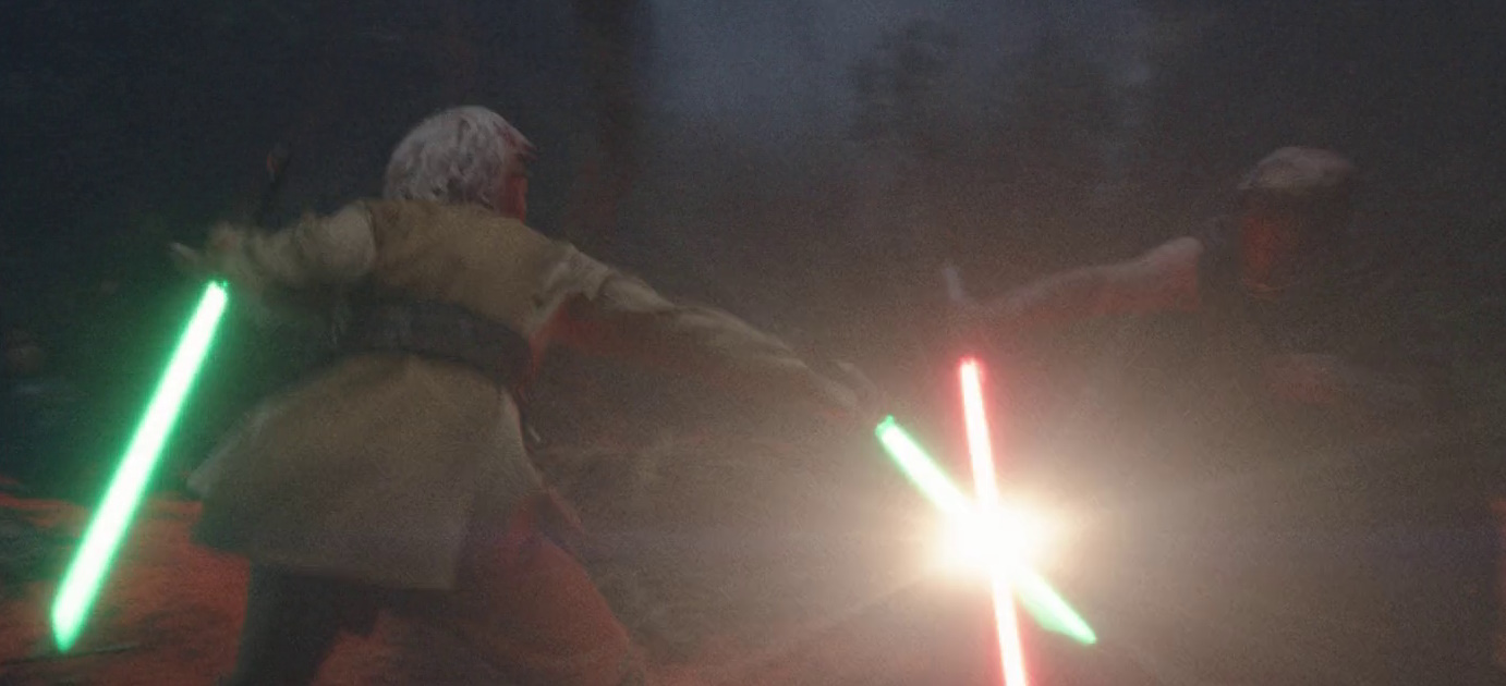 Still frame from Star Wars: The Acolyte showing two characters engaged in a lightsaber duel.