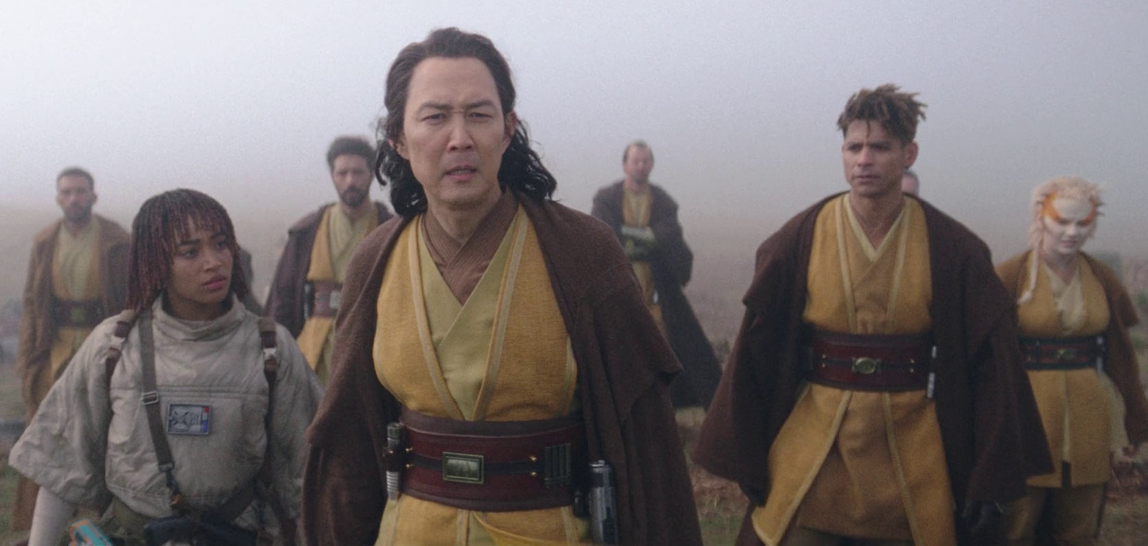 Still frame from Star Wars: The Acolyte showing a group of Jedi in yellow robes.