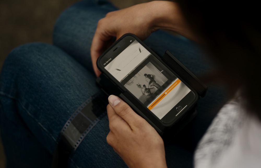 Still frame from Civil War (2024) showing Jessie developing photographs.