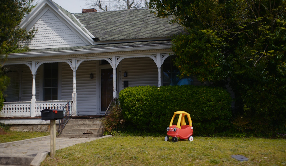 Still frame from Civil War (2024) showing a suburban house.