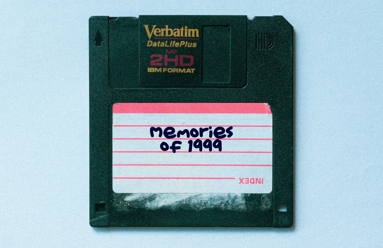 A photo of a floppy disc with the words "Memories of 1999" on the label.