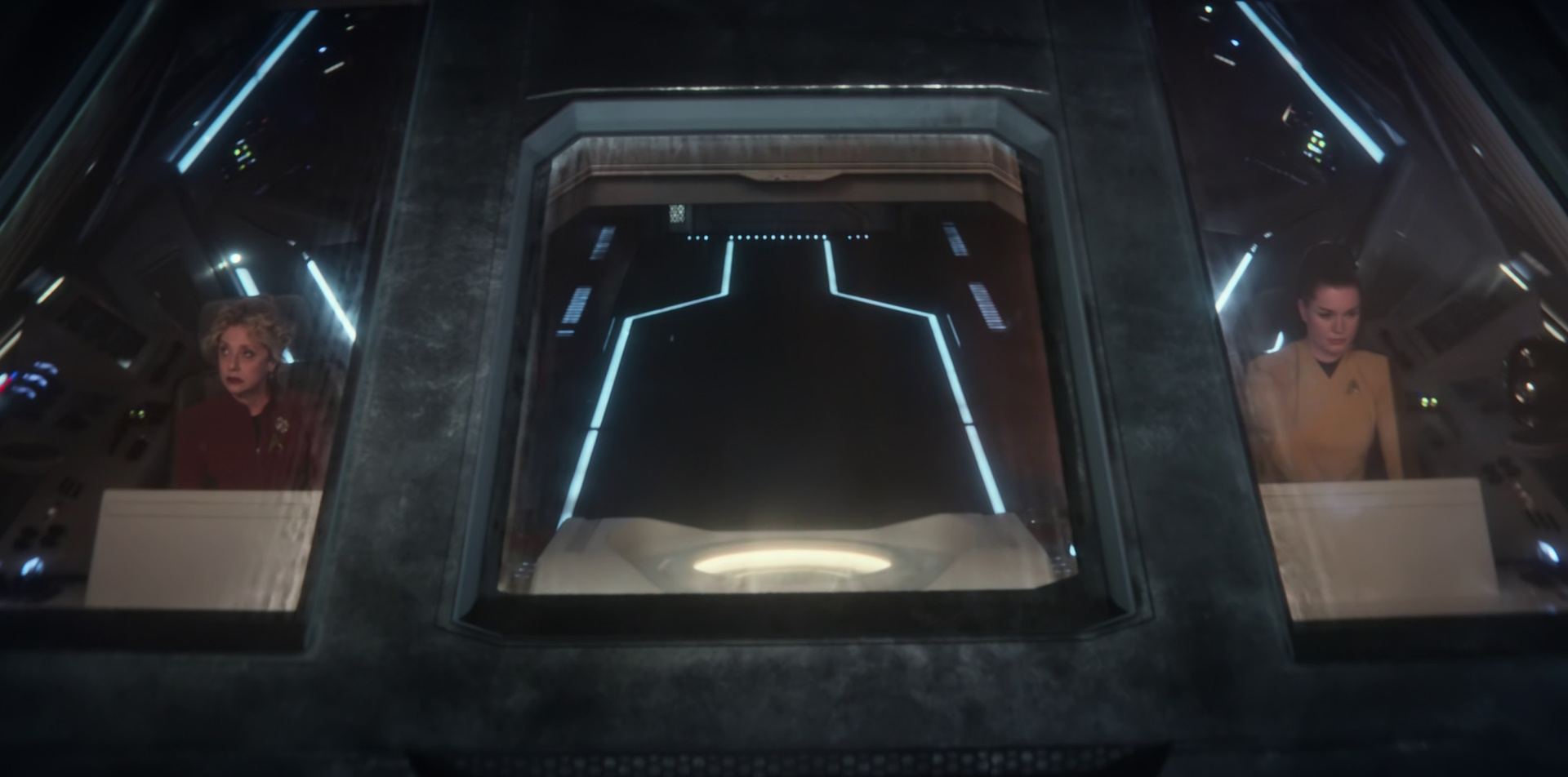 Still frame from Star Trek: Strange New Worlds Season 2 (2023) showing Una and Pelia on a shuttle.