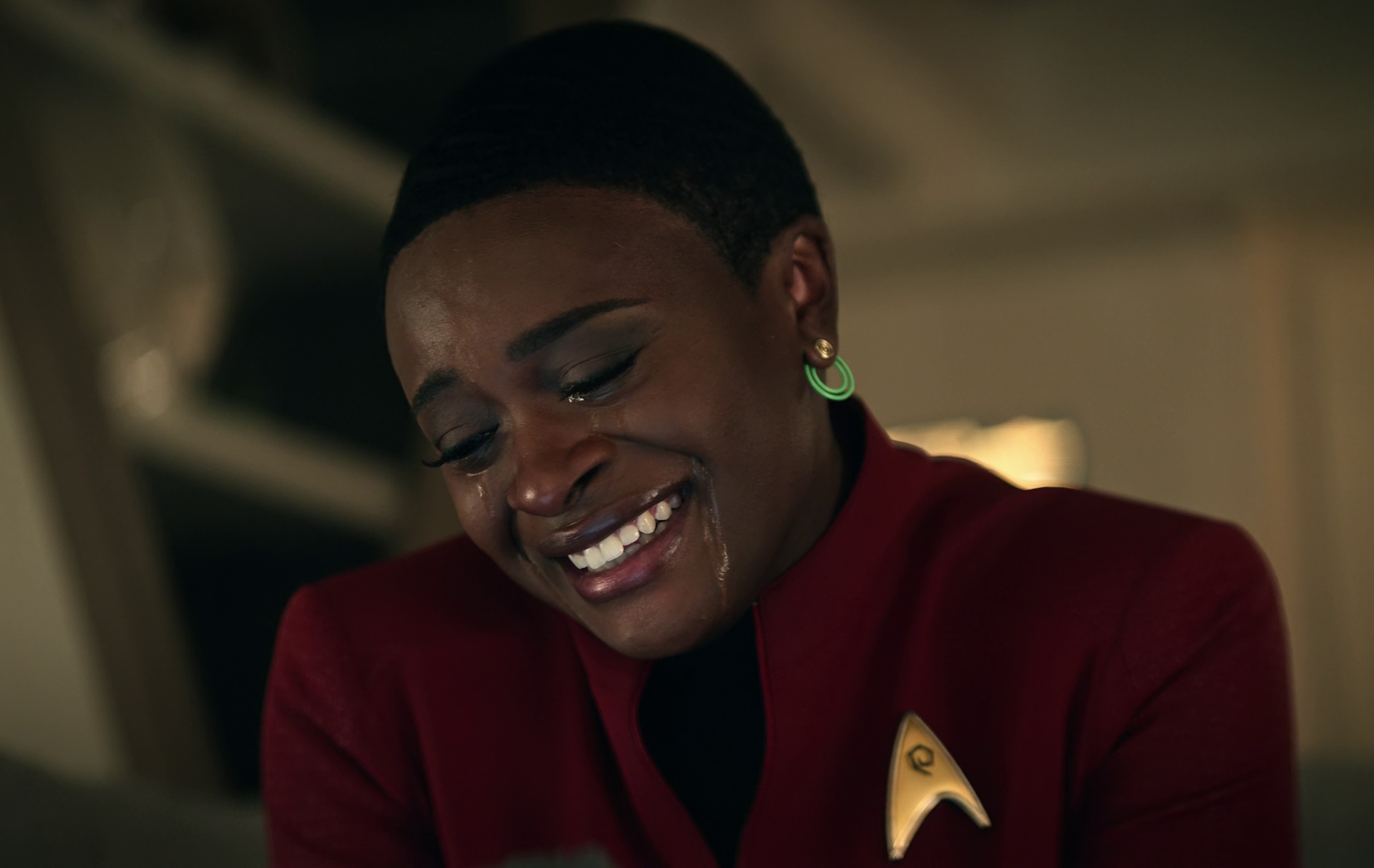 Still frame from Star Trek: Strange New Worlds Season 2 (2023) showing Uhura crying.