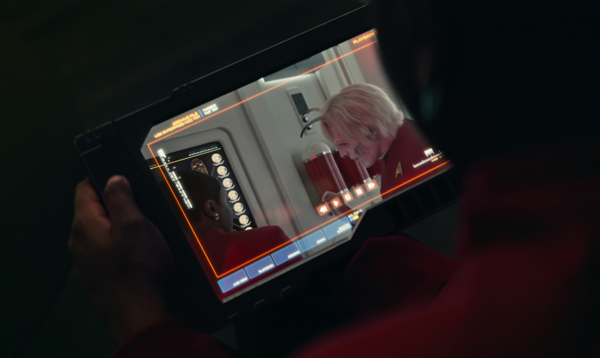 Still frame from Star Trek: Strange New Worlds Season 2 (2023) showing Uhura watching a recording.