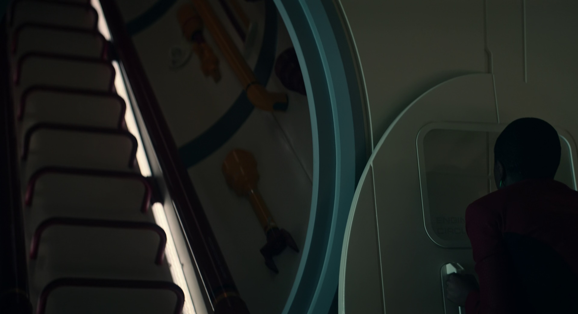 Still frame from Star Trek: Strange New Worlds Season 2 (2023) showing Uhura opening a hatch.