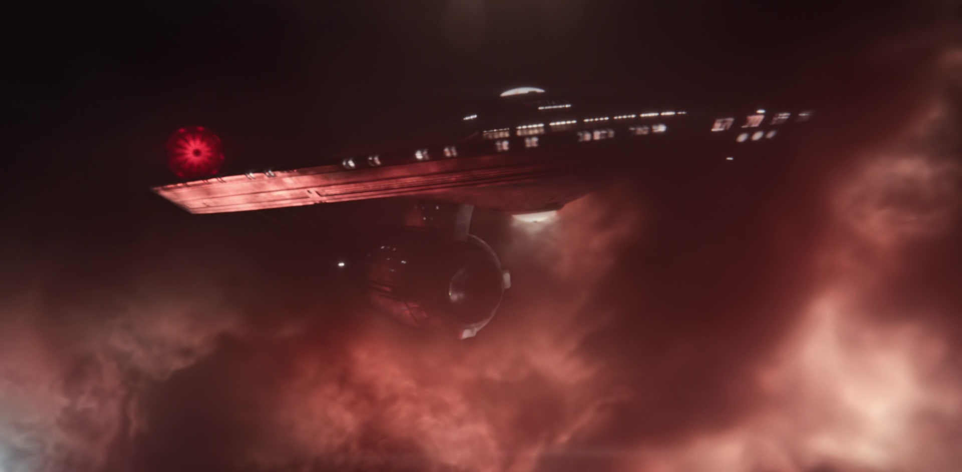 Still frame from Star Trek: Strange New Worlds Season 2 (2023) showing a CGI shot of the USS Enterprise in a nebula.