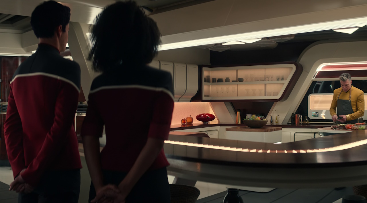 Still frame from Star Trek: Strange New Worlds Season 2 (2023) showing Boimler, Mariner, and Captain Pike.