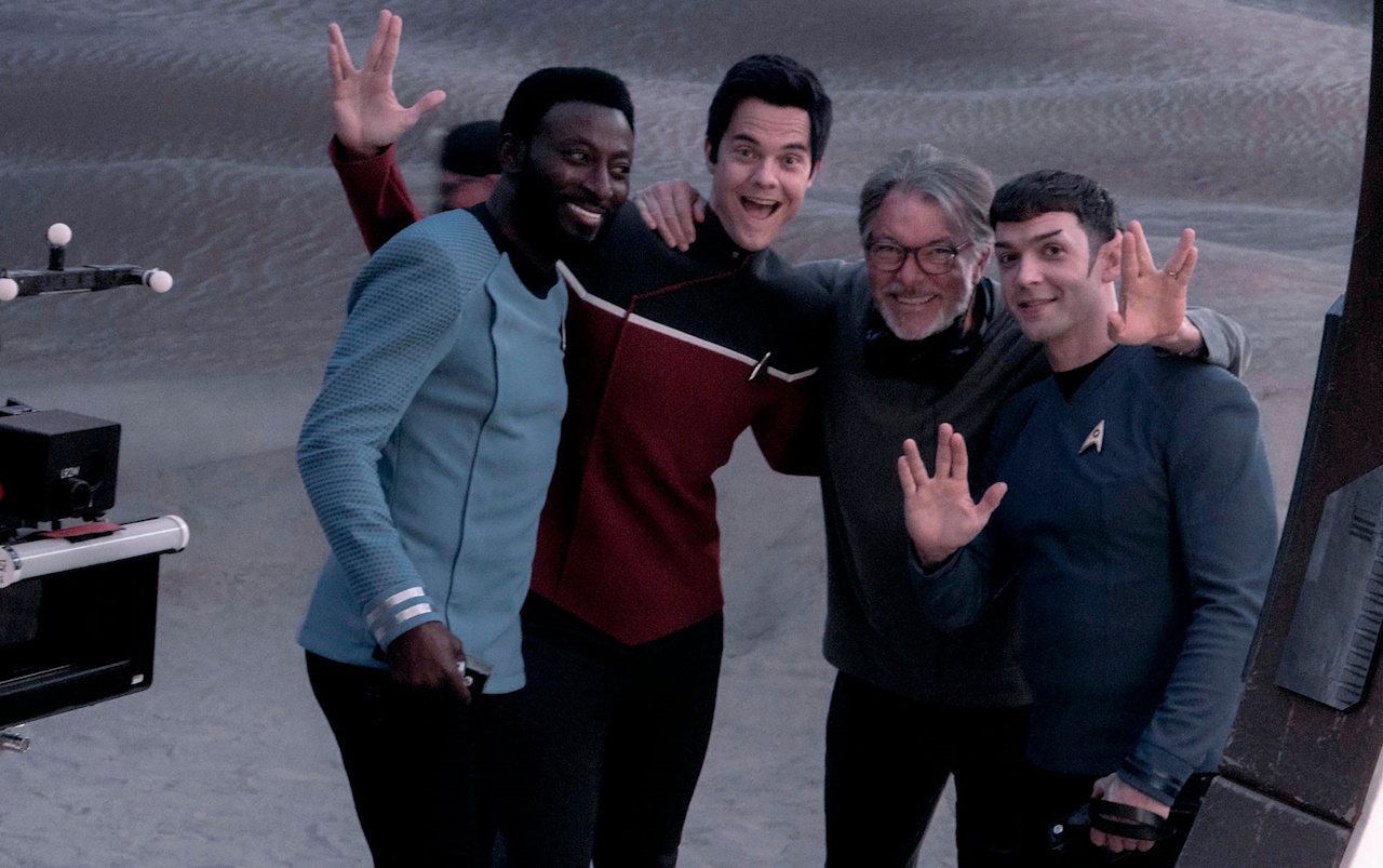Behind-the-scenes photo from the set of Those Old Scientists with Jonathan Frakes and three actors.
