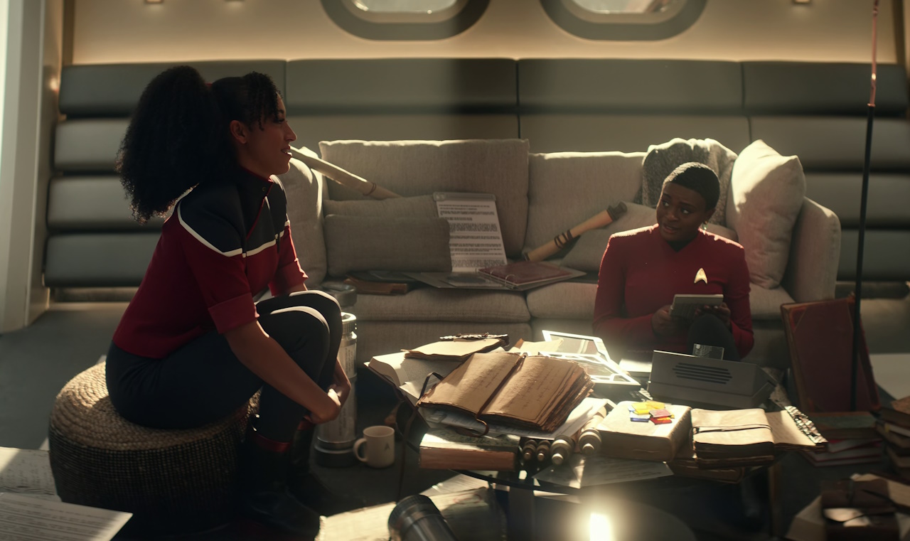 Still frame from Star Trek: Strange New Worlds Season 2 (2023) showing Mariner and Uhura in the latter's quarters.