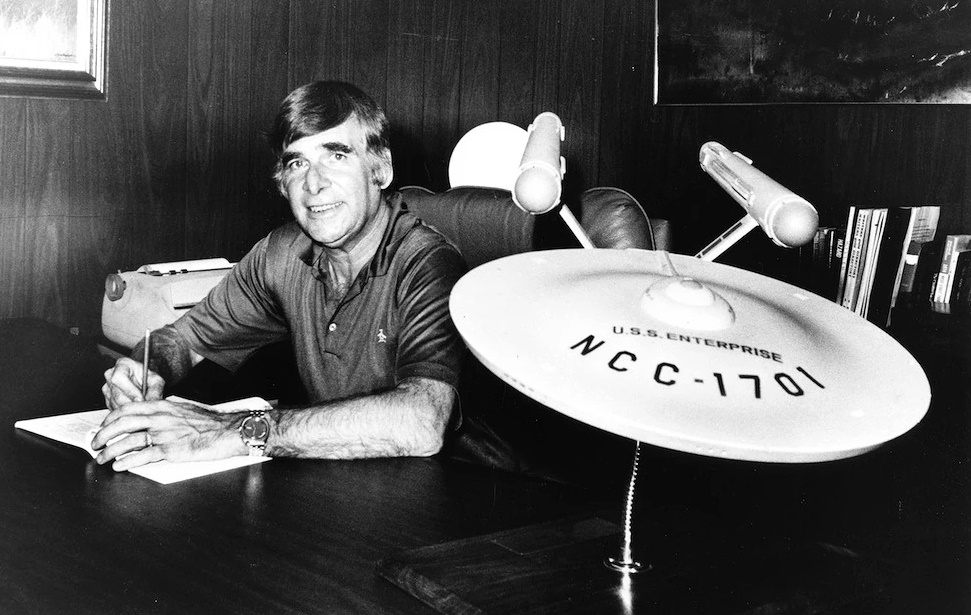 Photo of Gene Roddenberry with a model of the USS Enterprise c. 1970s.