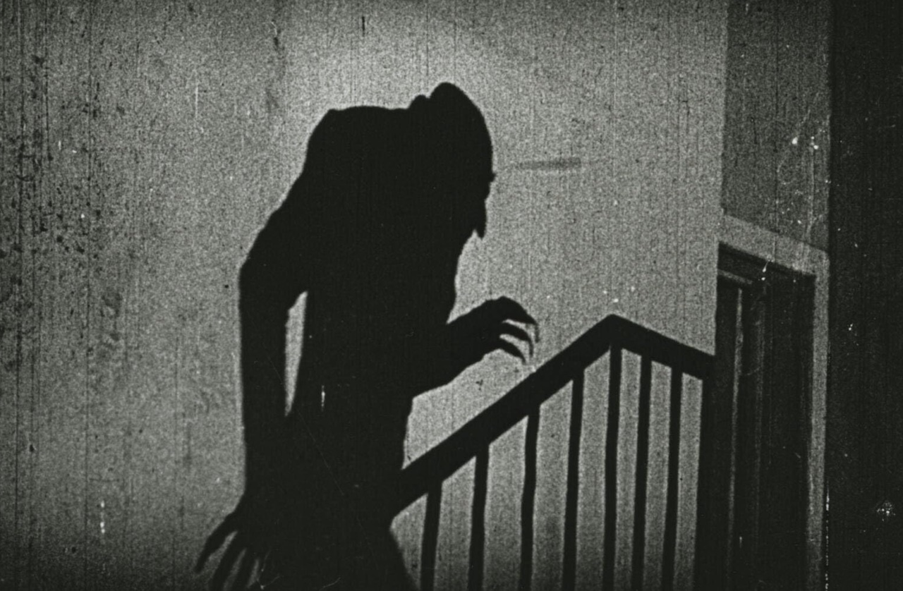Still frame from Nosferatu (1922) showing Orlok's shadow.