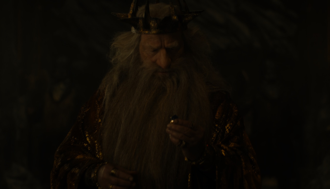 Still frame from The Lord of the Rings: The Rings of Power Season 2 (2024) showing King Durin examining his ring.