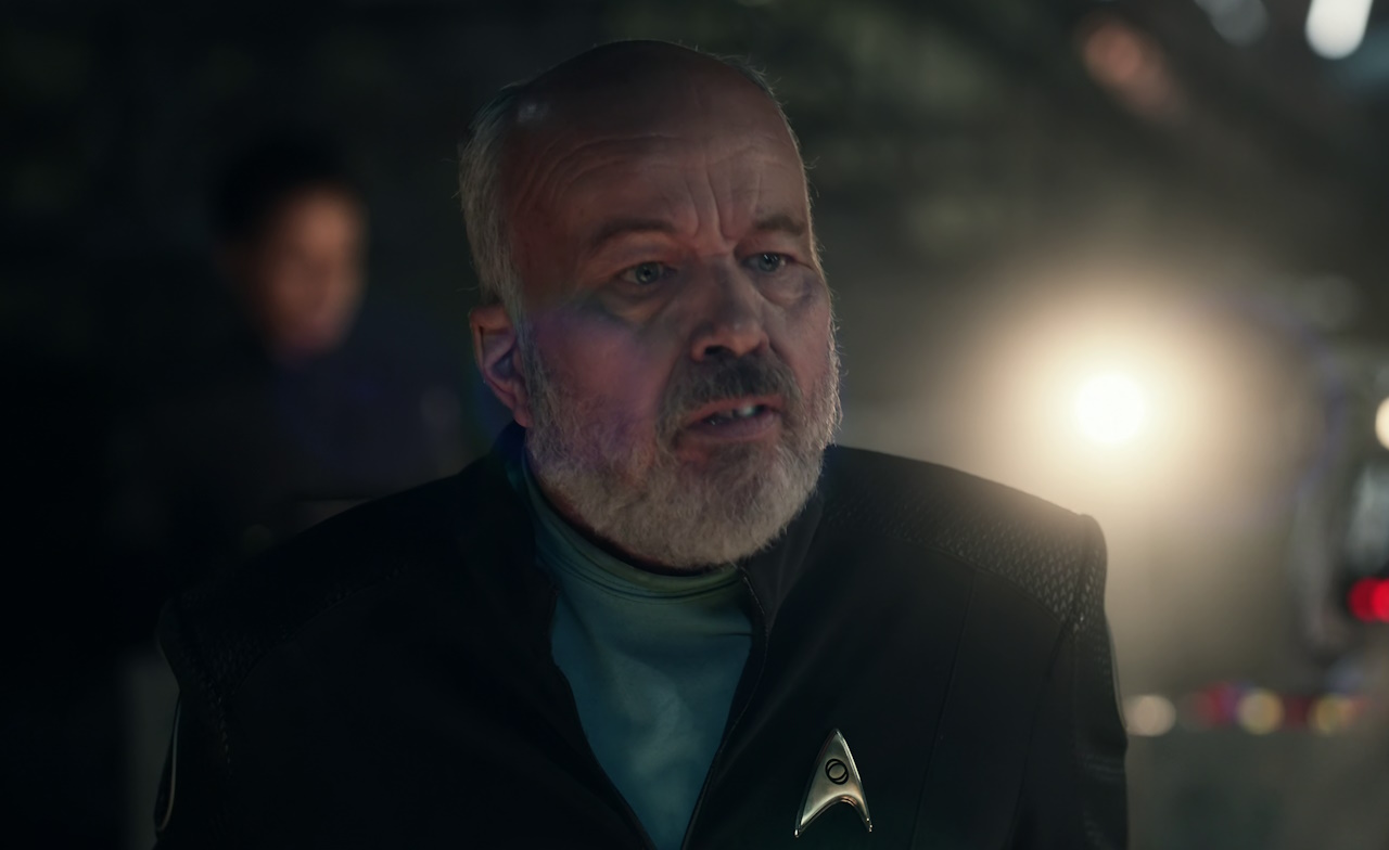 Still frame from Star Trek: Strange New Worlds Season 2 (2023) showing Clint Howard's character.