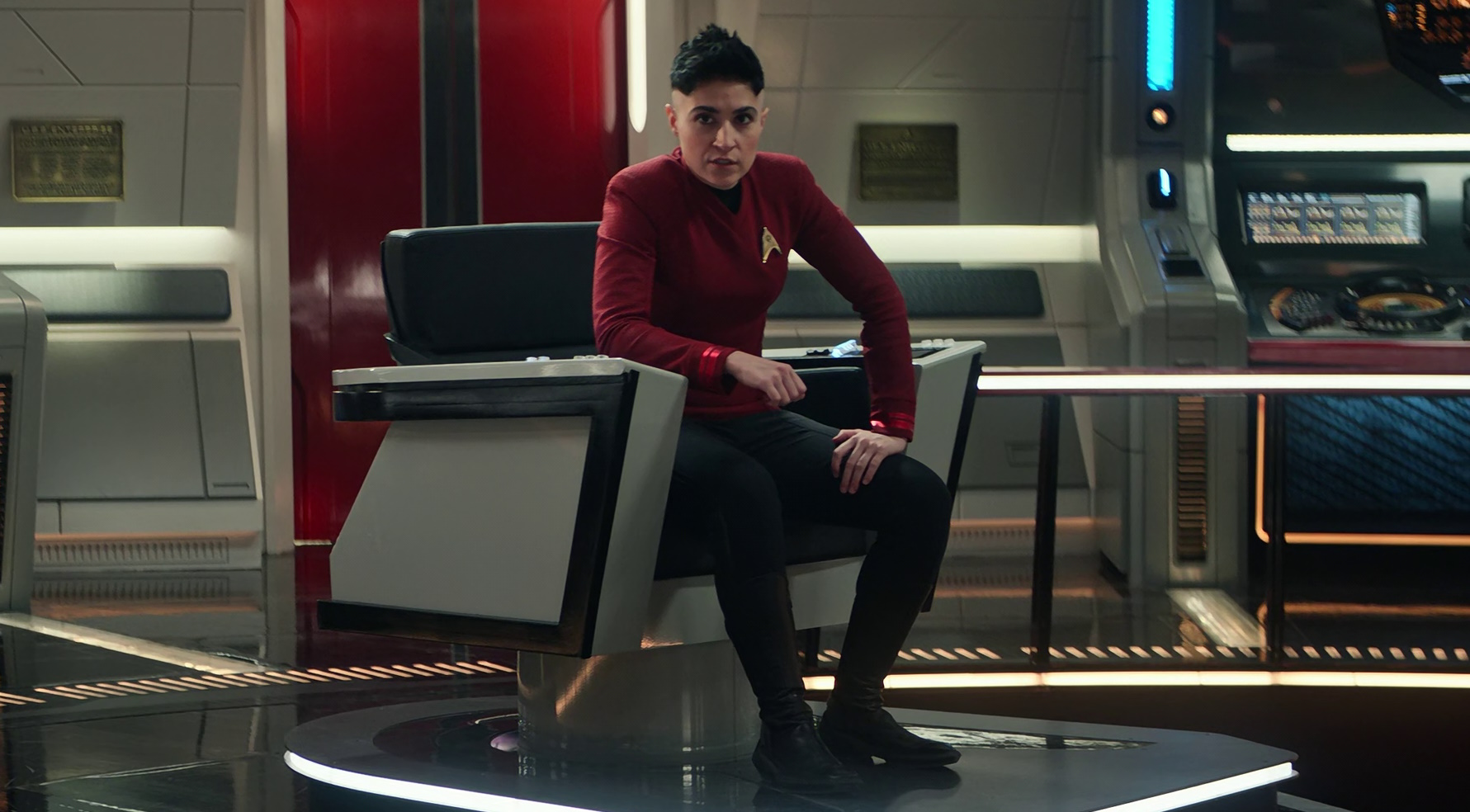 Still frame from Star Trek: Strange New Worlds Season 2 (2023) showing Lt. Ortegas in the captain's chair.