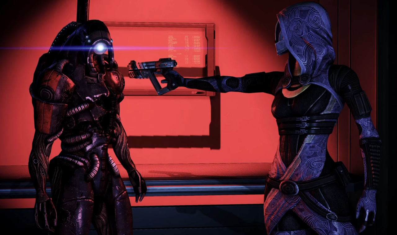 Screenshot of Mass Effect 2 showing Tali pointing a weapon at Legion.