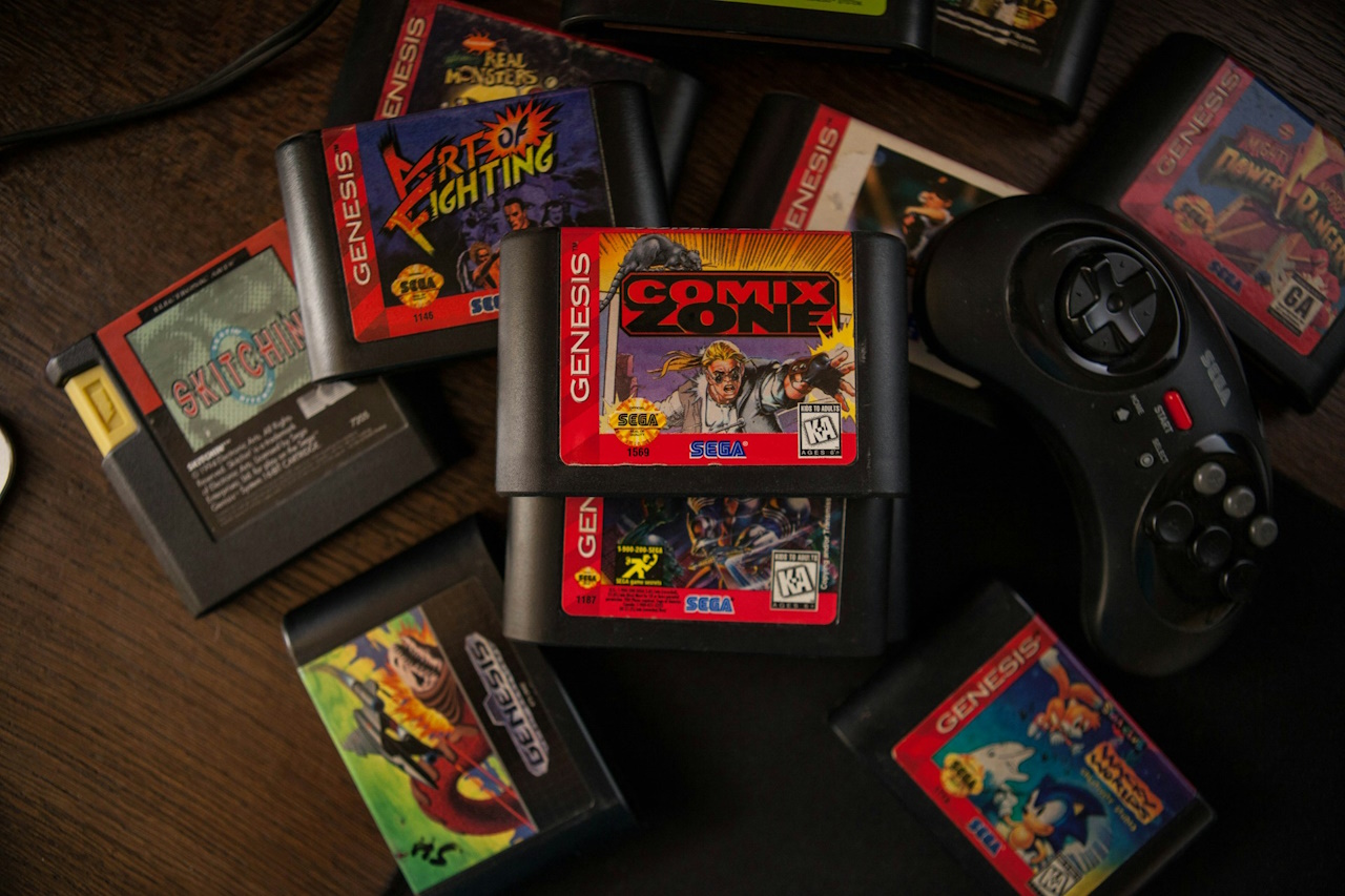Stock photo of Sega Mega Drive games and a control pad.