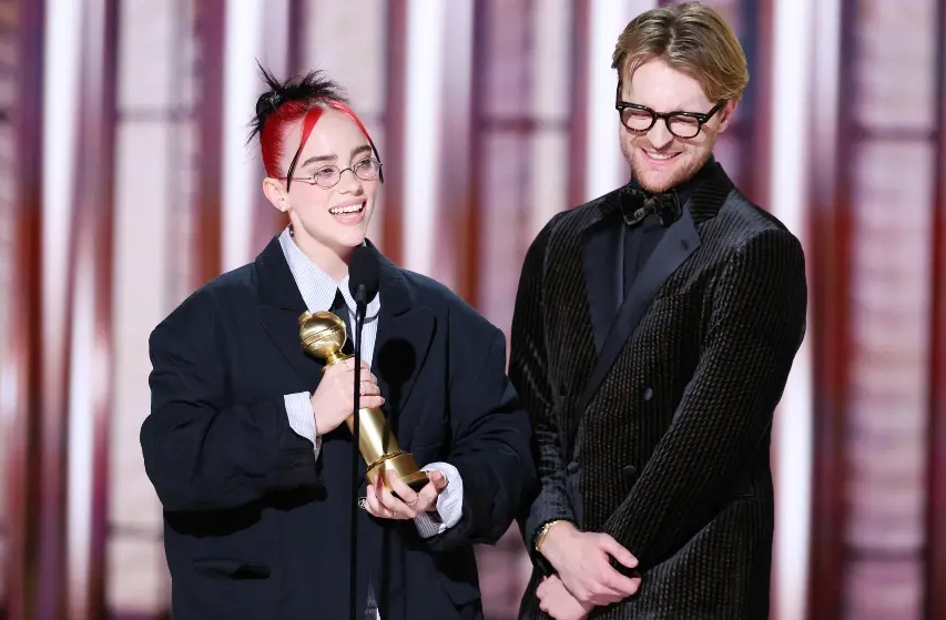 Photo from the 2024 Golden Globes showing two award-winners.