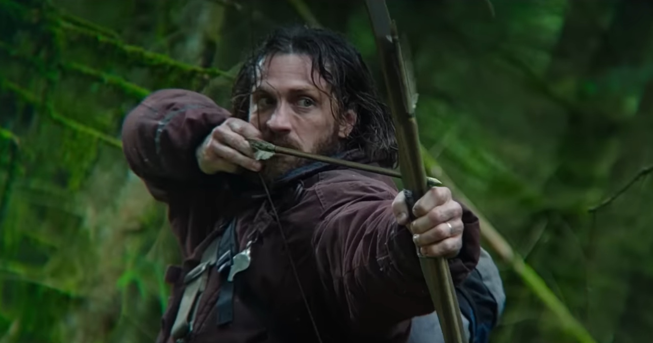 Still frame from the 28 Years Later trailer showing a man with a bow and arrow.