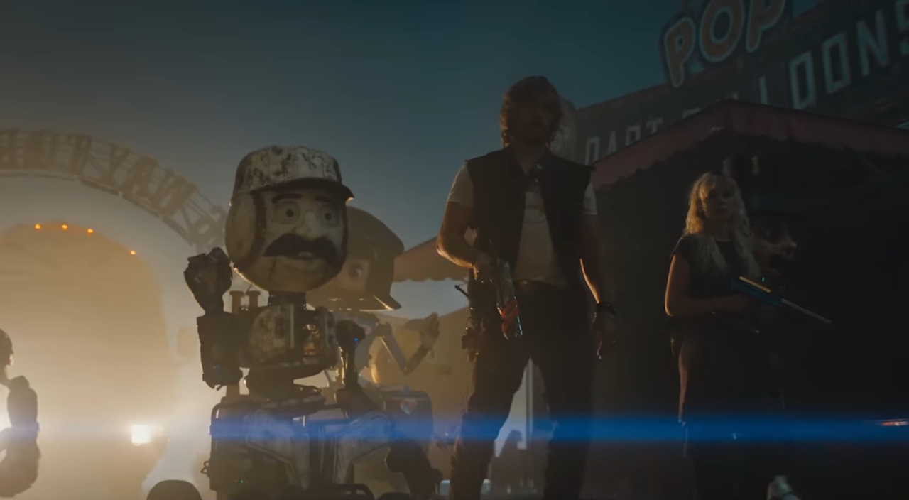 Still frame from the trailer for The Electric State showing several characters and robots.