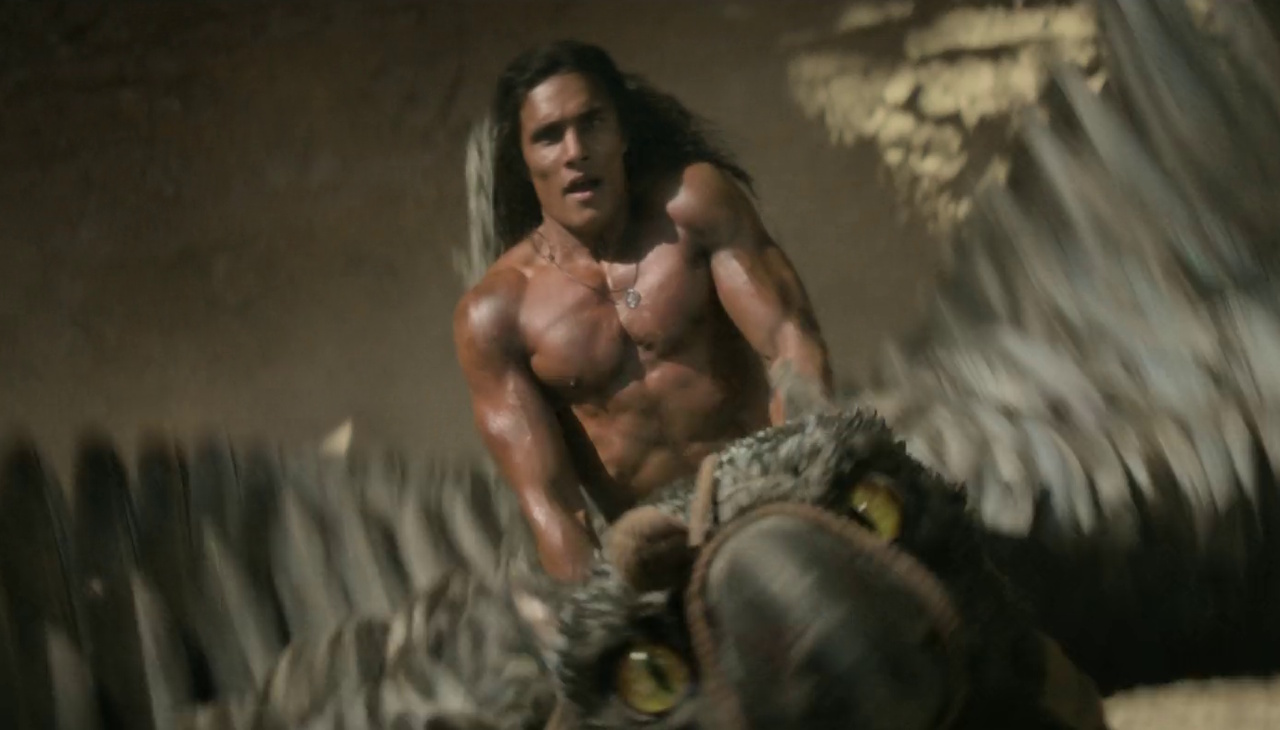 Still frame from Rebel Moon Part One showing a shirtless man riding a large bird.