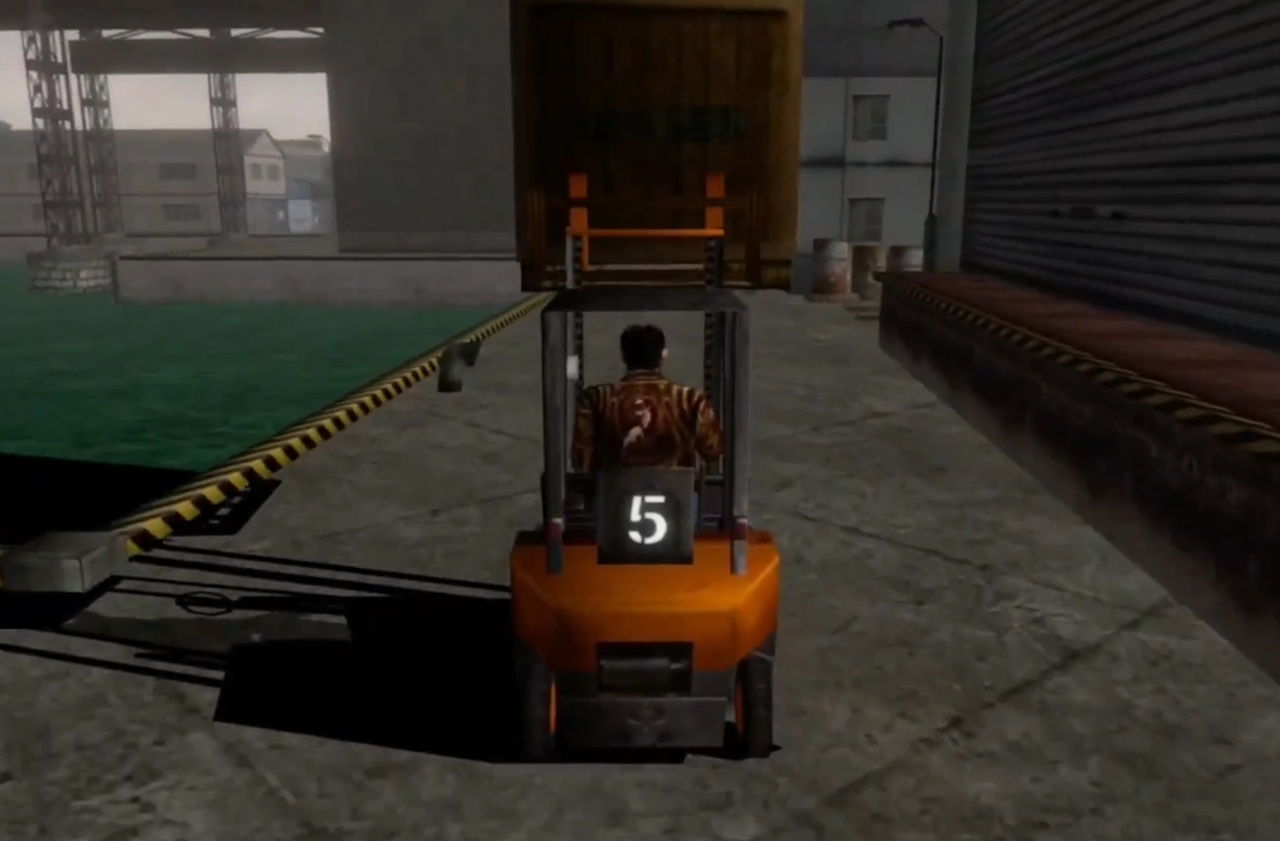 Screenshot of Shenmue (1999) showing Ryo driving a forklift at the harbour.