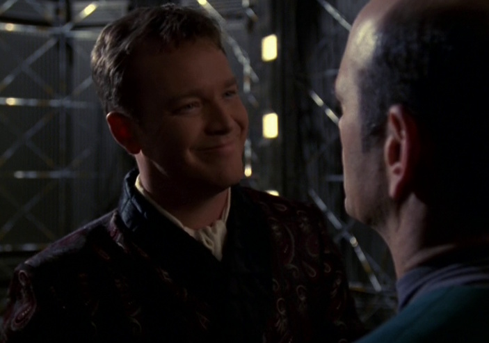 Still frame from Star Trek: Voyager showing a holographic Tom Paris and the Doctor.