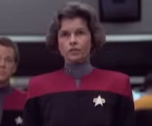 Still frame from the Star Trek: Voyager DVD special features showing Geneviève Bujold as Nicole Janeway.