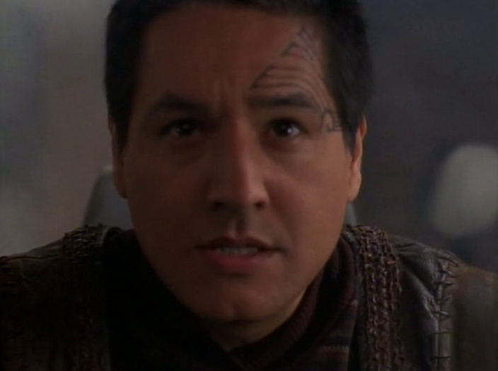 Still frame from Star Trek: Voyager showing a close-up of Chakotay in the series premiere.