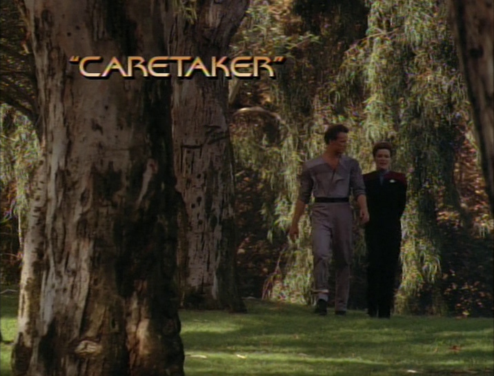 Still frame from Star Trek: Voyager showing the title "Caretaker" with Captain Janeway and Tom Paris.