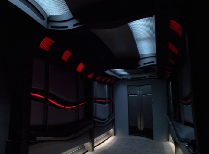 Still frame from Star Trek: Voyager showing a melting and distorted corridor.