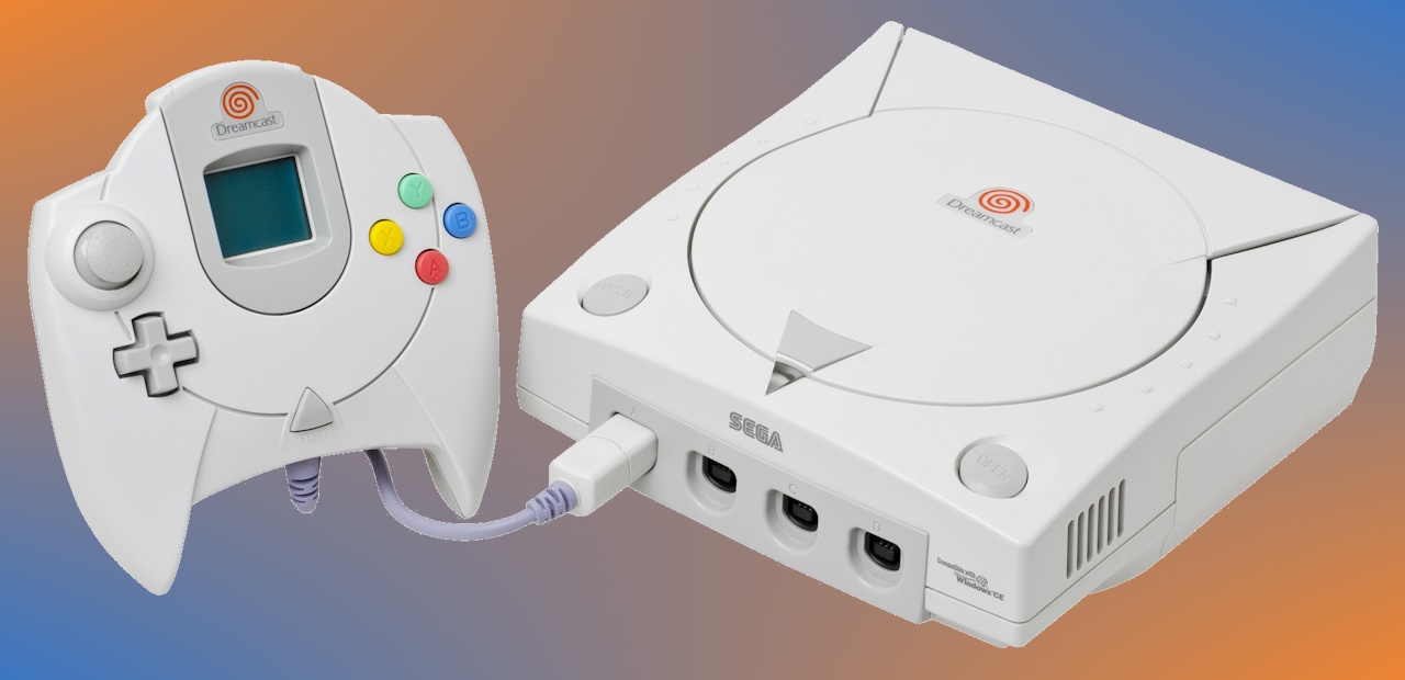A Sega Dreamcast console and control pad (USA/Japan edition) on an orange and blue background.