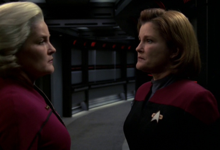 Still frame from Star Trek: Voyager showing an older Admiral Janeway with a younger Captain Janeway.
