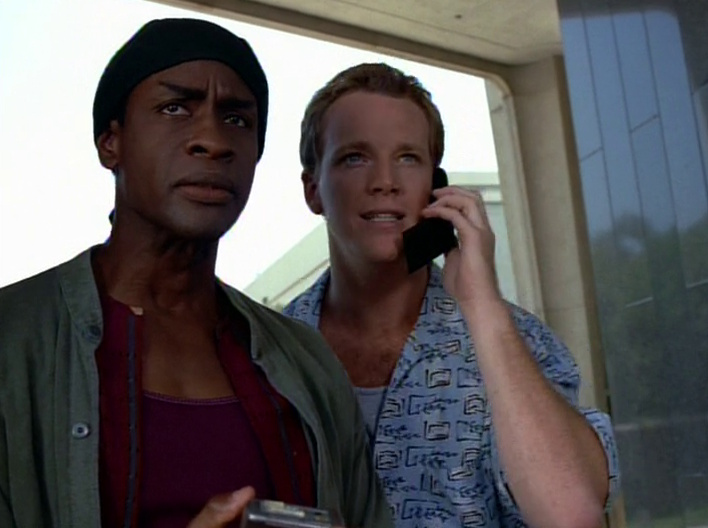 Still frame from Star Trek: Voyager showing Tuvok and Paris in the '90s using a mobile phone.