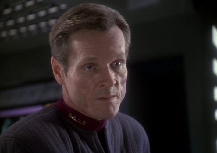 Still frame from Inquisition showing a close-up of Sloan.