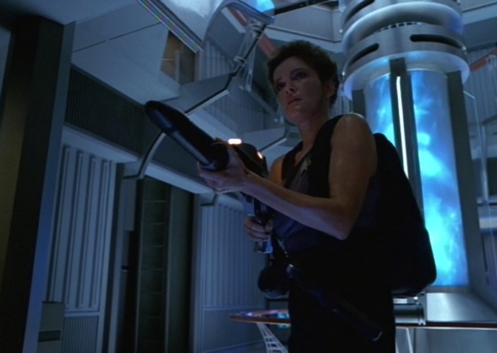 Still frame from Star Trek: Voyager showing Janeway wielding a phaser rifle.